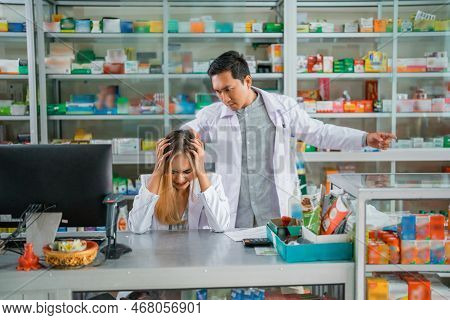 Asian Male Pharmacist Angry At Female Pharmacist For Mishandling Customers
