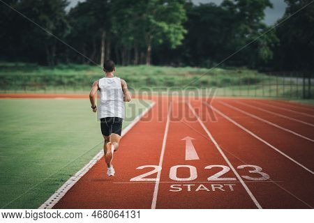 Happy New Year 2023 Sport Man Runner Running Into The New Year 2023. Start Up Of Runner Man Jogging 