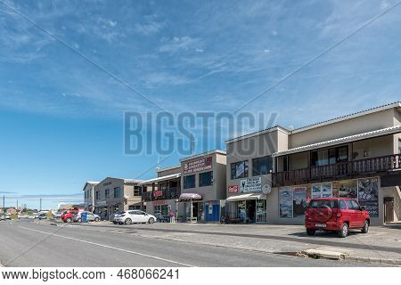 Struisbaai, South Africa - Sep 22, 2022: A Street Scene, With Businesses And Vehicles, In Struisbaai