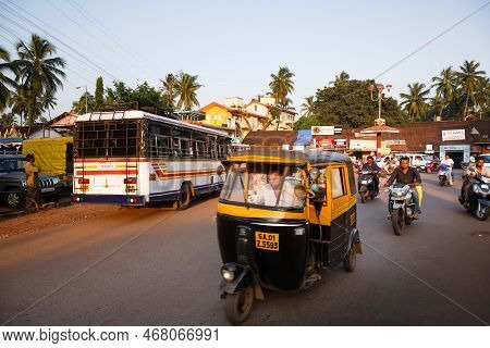 Panaji, India - November 09, 2011. Typical Busy Indian Street With Traffic. Auto Rickshaw, Bus And M