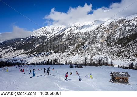 Val-cenis - France - February 24, 2022 : Skiers On Ski Slopes In The French Alps