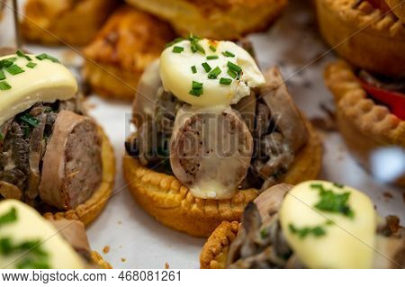 French Mini Quiche Pie With Goat Cheese And Traditional French Sausage Andouillette From Troyes In B