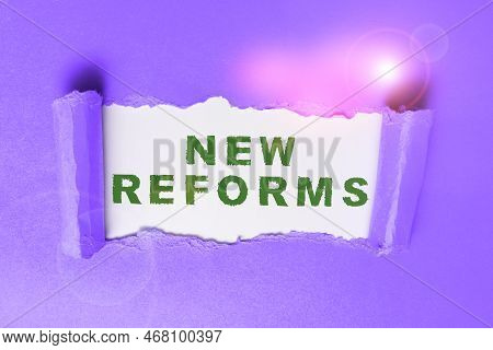 Handwriting Text New Reforms. Word For To Amend Or Improve By Change Of Form Or Removal Of Faults