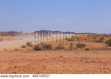 Namibian Landscape Along The Gravel Road. Yellow Ground And African Vegetation Around. Damaraland, H
