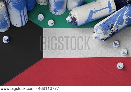 Kuwait Flag And Few Used Aerosol Spray Cans For Graffiti Painting. Street Art Culture Concept, Vanda