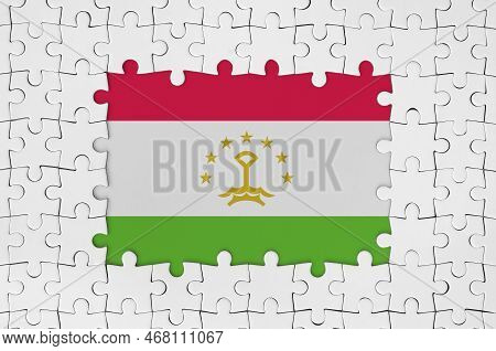 Tajikistan Flag In Frame Of White Puzzle Pieces With Missing Central Parts