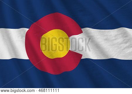 Colorado Us State Flag With Big Folds Waving Close Up Under The Studio Light Indoors. The Official S