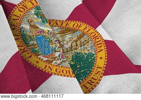 Florida Us State Flag With Big Folds Waving Close Up Under The Studio Light Indoors. The Official Sy
