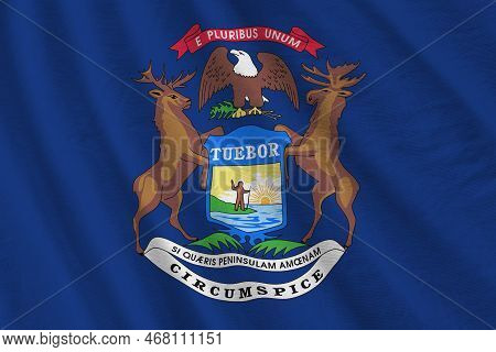 Michigan Us State Flag With Big Folds Waving Close Up Under The Studio Light Indoors. The Official S