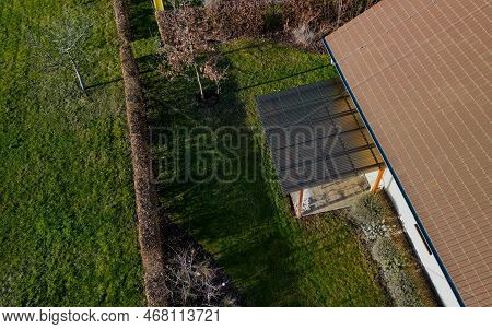 Terrace At The House In A Beautiful Garden Is Equipped With A Garden Furniture Made Wire Metal Chair