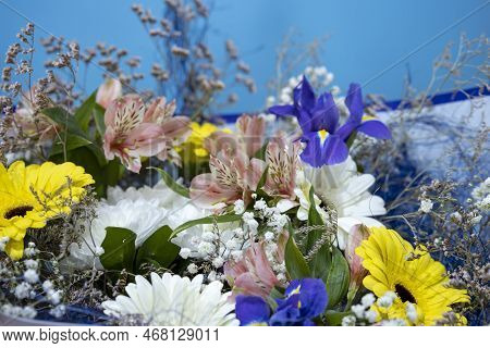 Rich Beautiful Bouquet. Fresh Autumn Bouquet.
Fresh Colorful Varied Flowers. Selective Focus.
