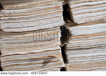 A Pile Of Old Document Papers On The Floor