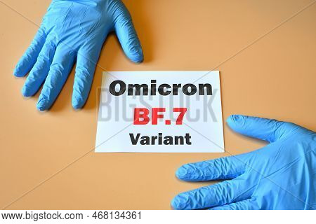 The Hands Of Doctor In Blue Gloves With White Paper And Text 