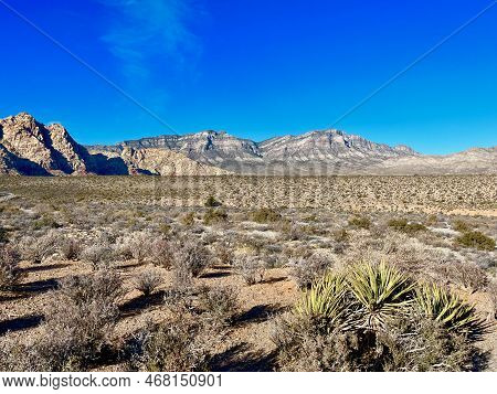 The Mountains Glow Fiery Red At Sunrise In Red Rock Canyon Las Vegas Nevada.
