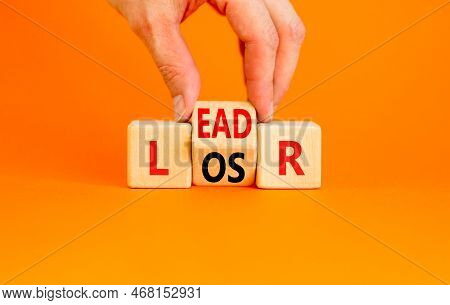 Leader Or Loser Symbol. Concept Word Leader Loser On Wooden Cubes. Beautiful Orange Table Orange Bac