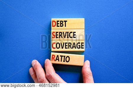 Dscr Debt Service Coverage Ratio Symbol. Concept Words Dscr Debt Service Coverage Ratio On Wooden Bl