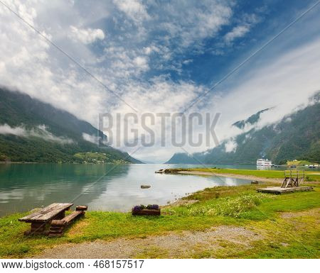 Lustrafjorden Fjord And Mountains Summer Cloudy Landscape, Norway. Panorama.