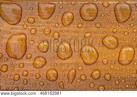 Horizontal Background Of Lacquered Burnt Wood Texture With Shiny Water Drops From The Rain, Wet Wood