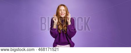 Girl Makes Wish Eager Dream Come True. Atractive Hopeful And Positive Young Redhead Woman In Purple 