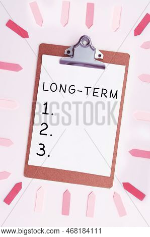 Writing Displaying Text Long Term. Word Written On Occurring Over Or Involving A Relatively Long Per