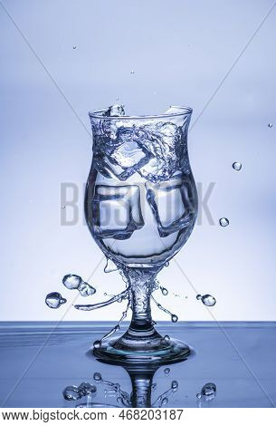 The Image Of Pouring Drinking Water, Into A Broken Glass, That Makes One Feel Refreshed On Blurred W