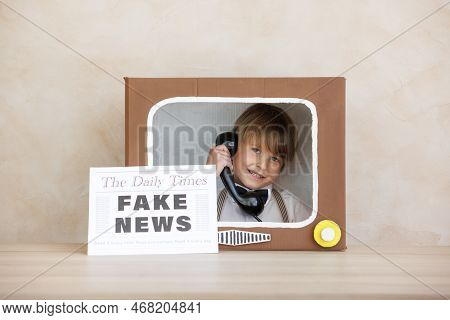 Newsboy Shouting Against Grunge Wall Background. Boy Selling Fake News
