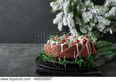 Christmas Chocolate Bundt Cake. Traditional Christmas Fruit Cake With White Glaze, Cranberries And R