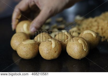 Preparation Of Moong Dal Laddu In A Ball Form With Hand. It Is A Protein Rich, Indian Sweet Made Of