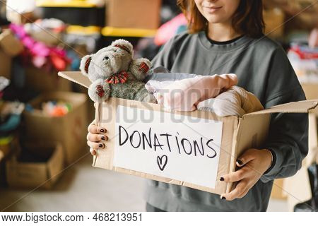 Volunteer Teengirl Preparing Donation Boxes For People. Donation Clothing For Refugees, Support Of W