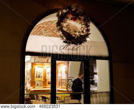 Strasbourg, France - Oct 25, 2022: Artistic Hotel Signage Insignia On Glass With Christmas Crown Abo