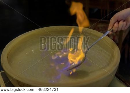 Flambe Fire In A Pecorino Cheese Wheel For Pasta, Restaurant In Florence, Italy