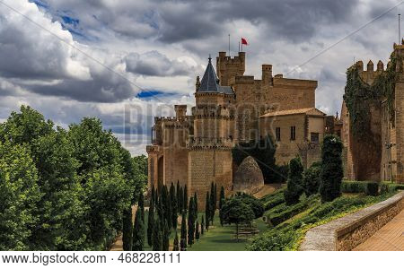 Cypress Trees Leading To The Gothic Royal Palace Of Navarre In Olite, Spain