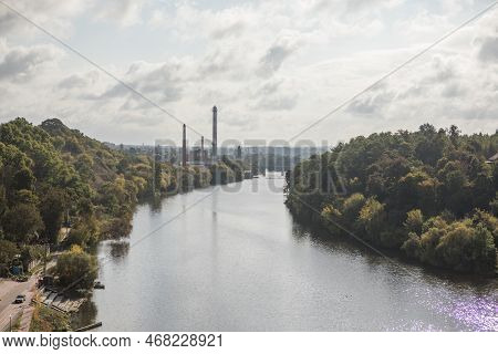 Autumn Scenery With Colorful Trees Reflected In The Water. Pedestrian Bridge Across Teteriv River, Z