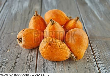 Medlar Ripe, Loquats Fruits Group Of Japanese Orange Fruit Medlars, Exotic, Juicy Sweet Plums On Woo