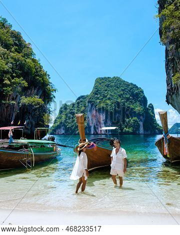 Couple Visit Koh Lao Lading Near Koh Hong Krabi Thailand, Beautiful Beach With Longtail Boats