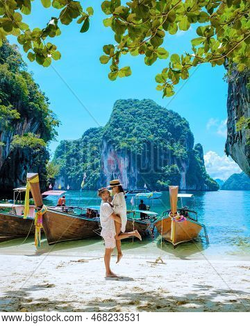 Couple Visit Koh Lao Lading Near Koh Hong Krabi Thailand, Beautiful Beach With Longtail Boats