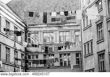 Clothes Hanging To Dry On A Clothes-line. Laundry Dryings On The Rope. Washed Clothes Drying Outside