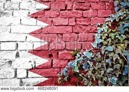 Bahrein Grunge Flag On Brick Wall With Ivy Plant, Country Symbol Concept