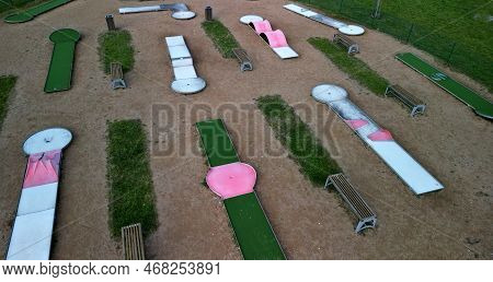 Minigolf Course In Park Catch Golf Balls Behind Obstacle. Game For Points Below Par Or Above Par, Re