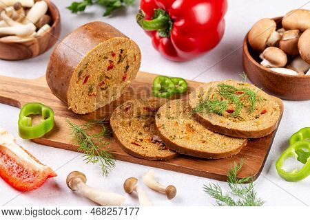 Mushroom Based Vegan Sausage With Vegetables And On Wooden Board, Top View