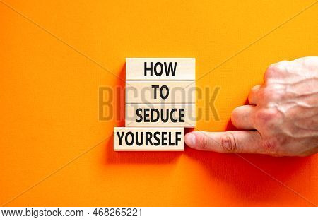 How To Seduce Yourself Symbol. Concept Word How To Seduce Yourself On Wooden Blocks. Businessman Han