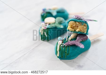 Sliced Cakesicles With A Chocolate Mermaid Tail.