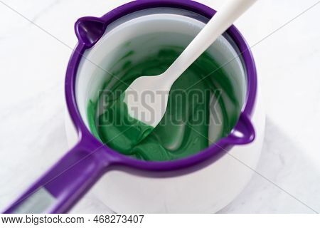 Melting Chocolate Melts In A Candy Melting Pot To Prepare Mermaid Cakesicles.