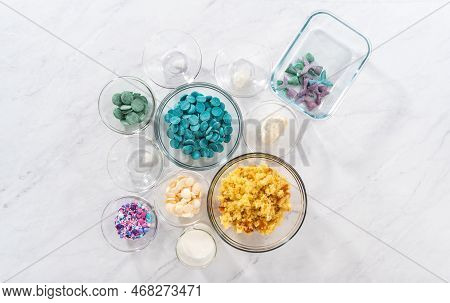 Flat Lay. Measured Ingredients In Glass Bowls To Prepare Mermaid Cakesicles.