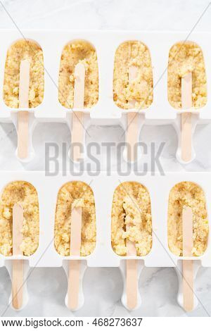 Filling Silicone Molds With Cake Crumbs To Prepare Mermaid Cakesicles.