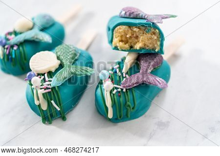 Sliced Cakesicles With A Chocolate Mermaid Tail.