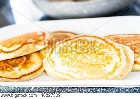 Freshly Made Pancakes On A White Serving Plate.