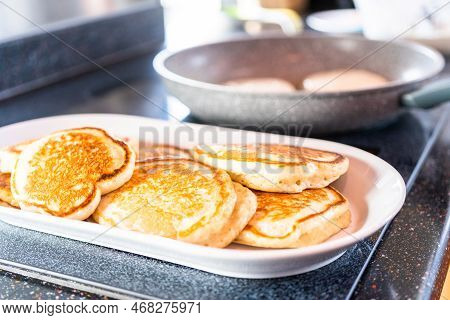 Freshly Made Pancakes On A White Serving Plate.