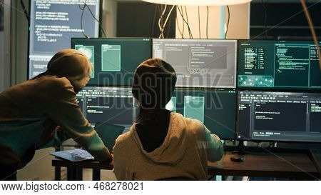Diverse Criminals Hacking Security Server With Malware, Working On Cyberbullying Late At Night. Hack