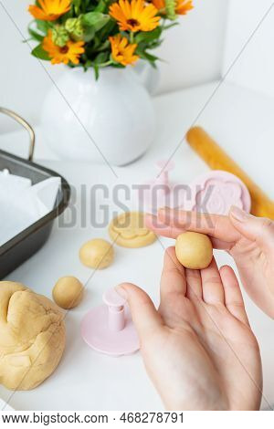 Preparing The Dough For Making Cookies With Molds In The Form Of Flowers, A Rolling Pin, A Bouquet O